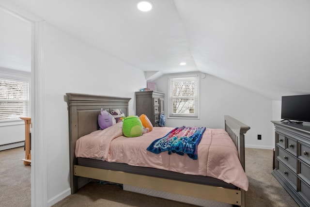 carpeted bedroom with lofted ceiling and a baseboard heating unit