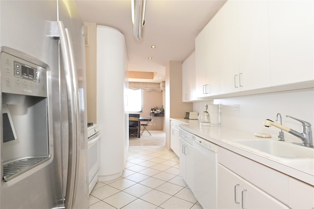 kitchen with white appliances, white cabinetry, light tile patterned flooring, light countertops, and a sink