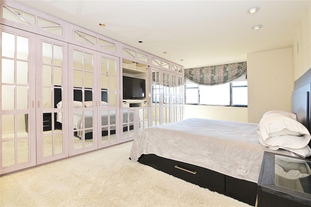 carpeted bedroom featuring recessed lighting
