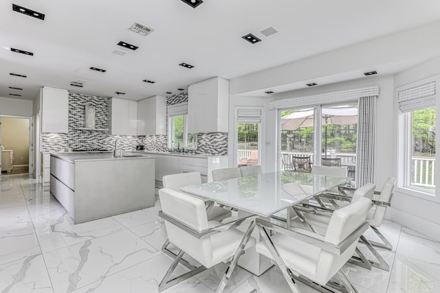 dining room with marble finish floor and visible vents