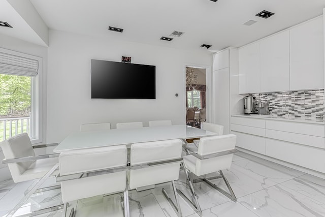 dining room with marble finish floor and visible vents