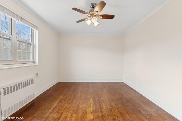 unfurnished room with radiator, crown molding, dark hardwood / wood-style floors, and ceiling fan