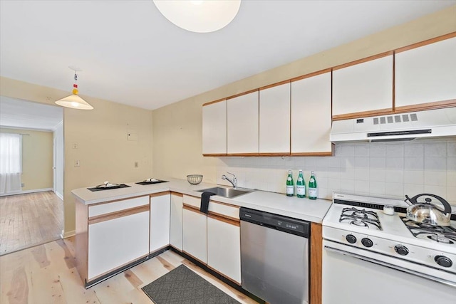 kitchen with pendant lighting, sink, white cabinets, white range with gas cooktop, and stainless steel dishwasher