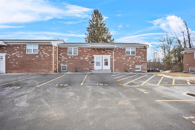 view of property with uncovered parking