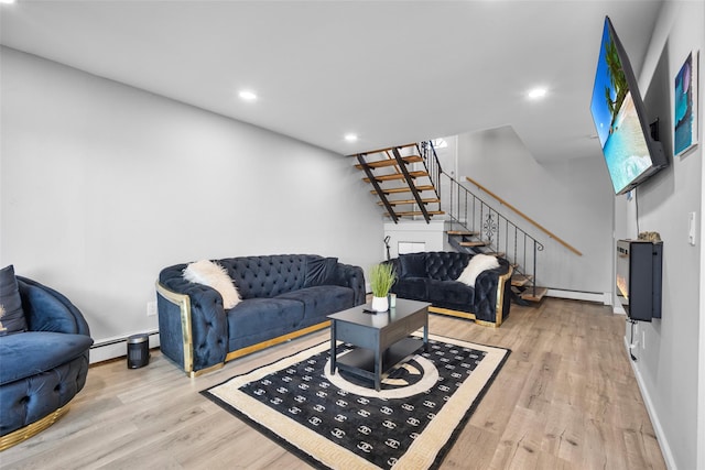 living area featuring stairs, recessed lighting, a baseboard heating unit, and wood finished floors