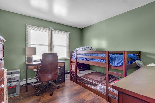 bedroom with dark hardwood / wood-style floors