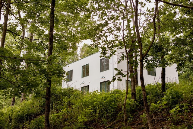 view of side of property featuring stucco siding