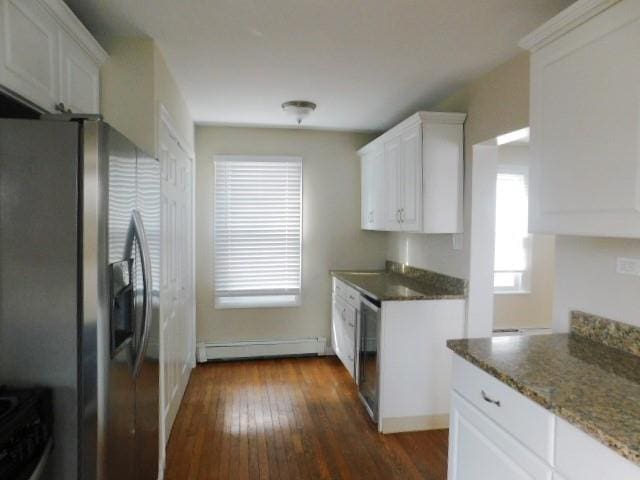 kitchen with a baseboard heating unit, dark hardwood / wood-style flooring, stainless steel fridge with ice dispenser, and white cabinets