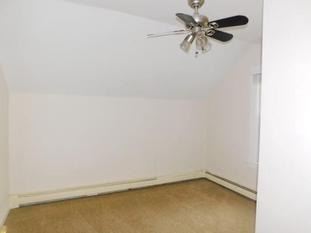 bonus room with a baseboard radiator, lofted ceiling, light carpet, and ceiling fan