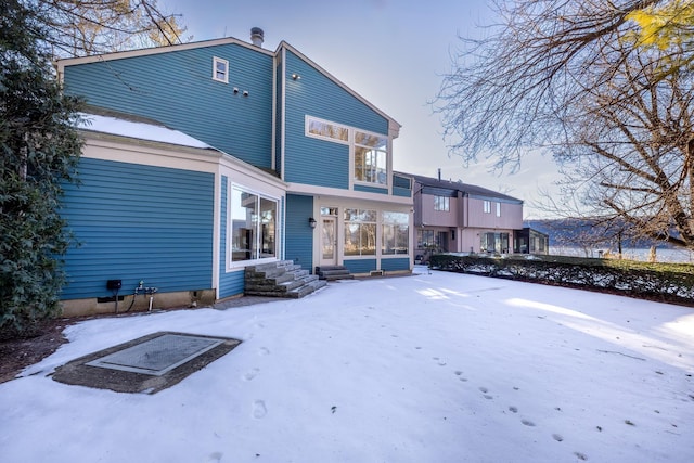 view of snow covered house