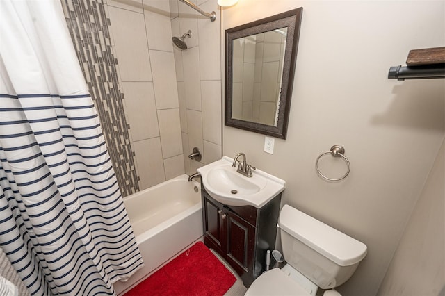 bathroom featuring shower / bath combo, vanity, and toilet