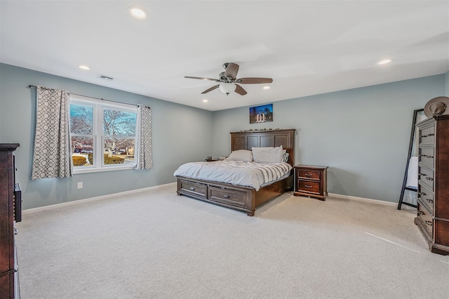 bedroom with recessed lighting, light colored carpet, and baseboards