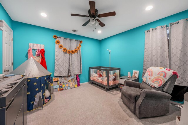 carpeted bedroom with ceiling fan, visible vents, and recessed lighting