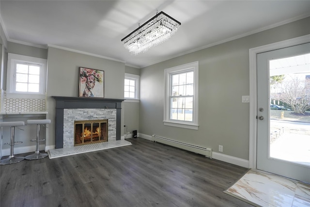 unfurnished living room with a baseboard radiator, a stone fireplace, ornamental molding, and dark hardwood / wood-style flooring