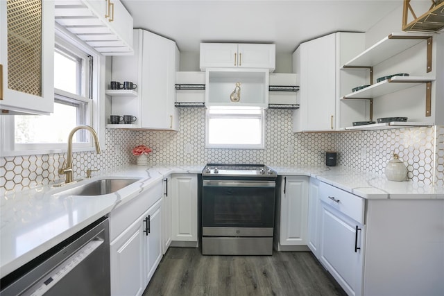 kitchen with white cabinetry, dishwasher, and stainless steel electric range oven