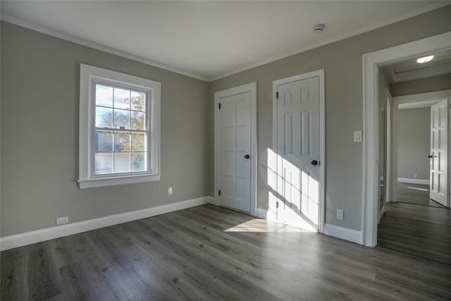 unfurnished room with crown molding and dark wood-type flooring