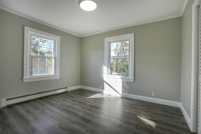 spare room with dark hardwood / wood-style flooring, crown molding, a wealth of natural light, and baseboard heating