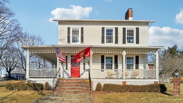 view of front of property with covered porch and a chimney