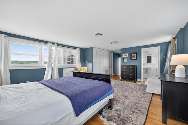 50 Maple Ave, Goshen, NY 10924 - bedroom with wood finished floors and connected bathroom