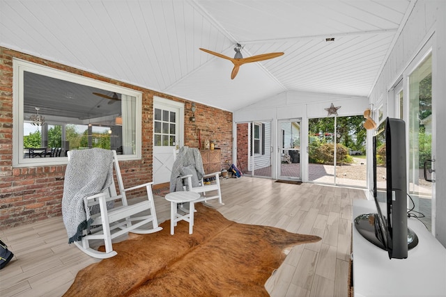 50 Maple Ave, Goshen, NY 10924 - sunroom / solarium with brick wall, plenty of natural light, wood finished floors, a ceiling fan, and lofted ceiling