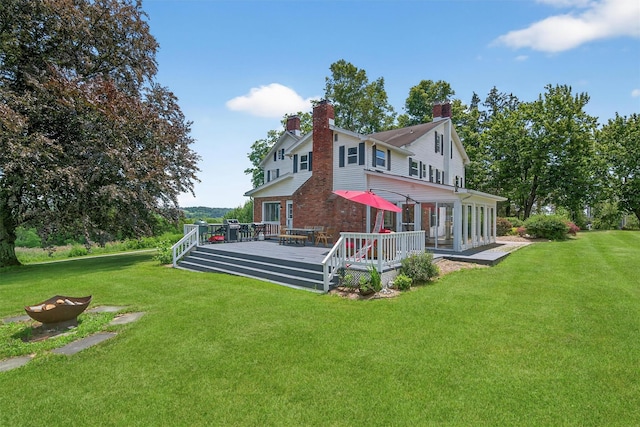 50 Maple Ave, Goshen, NY 10924 - back of property with a yard, a wooden deck, a chimney, and an outdoor fire pit