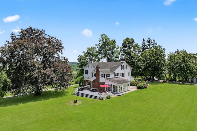 50 Maple Ave, Goshen, NY 10924 - back of house featuring a lawn, a chimney, and a deck