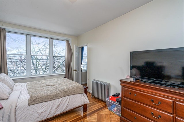 bedroom featuring radiator