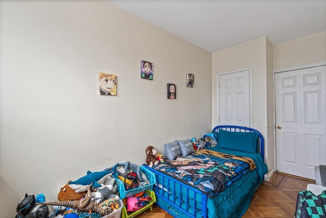 bedroom with parquet flooring