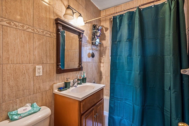 full bathroom featuring tile walls, vanity, toilet, and shower / bath combo with shower curtain