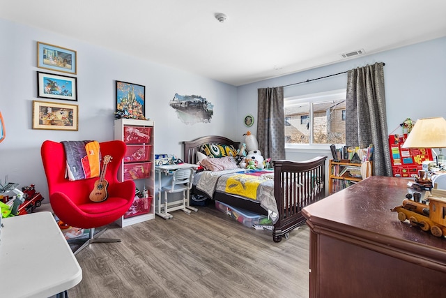 bedroom with wood-type flooring