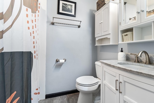 bathroom featuring vanity and toilet