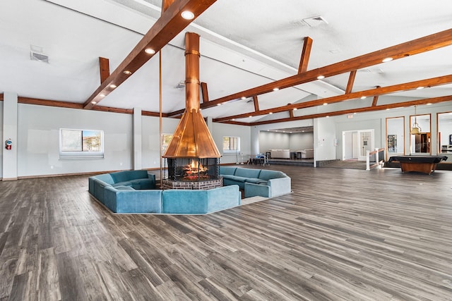 living room featuring hardwood / wood-style floors and lofted ceiling with beams