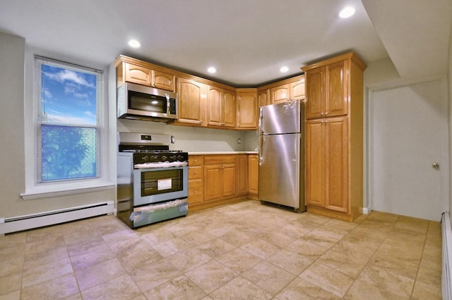 kitchen featuring a baseboard heating unit, light countertops, appliances with stainless steel finishes, and recessed lighting