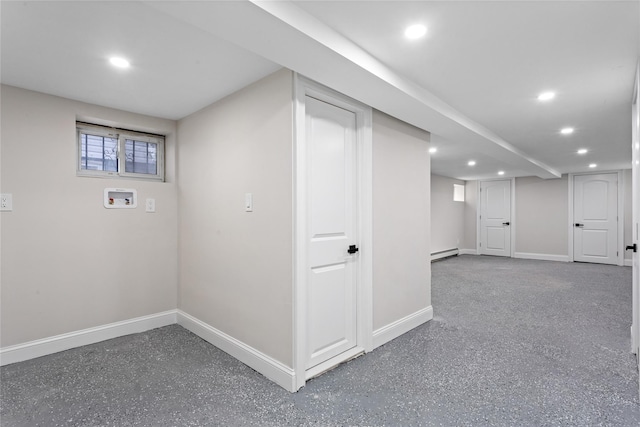 basement featuring a baseboard heating unit