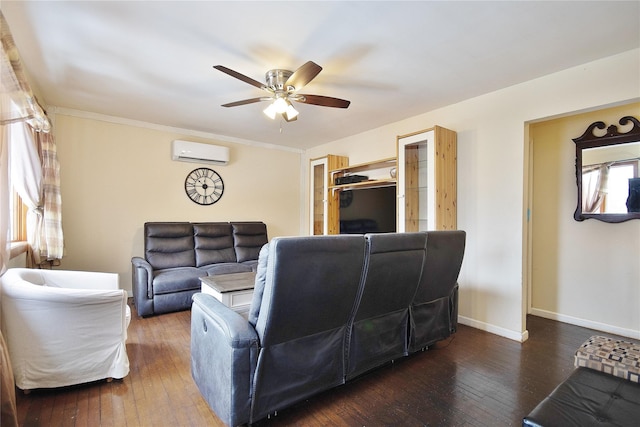 living room featuring a wall unit AC, hardwood / wood-style flooring, ceiling fan, and baseboards