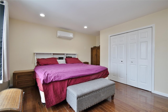 bedroom featuring a wall mounted AC, wood finished floors, and recessed lighting