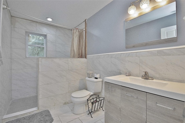 full bath featuring toilet, walk in shower, tile walls, and vanity