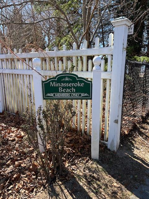 community sign with fence