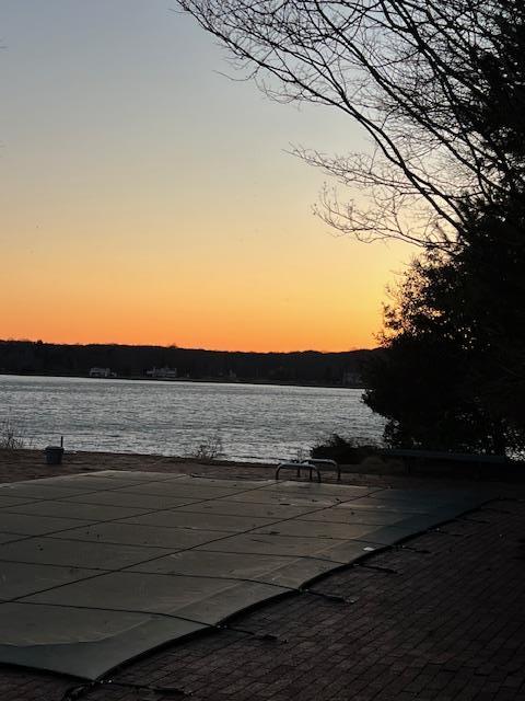 view of patio with a water view