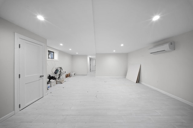 15815 77th Rd, Fresh Meadows, NY 11366 - finished below grade area featuring light wood finished floors, baseboards, a wall mounted AC, and recessed lighting