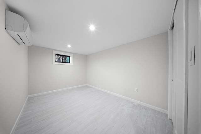15815 77th Rd, Fresh Meadows, NY 11366 - interior space with recessed lighting, an AC wall unit, baseboards, and light wood-type flooring