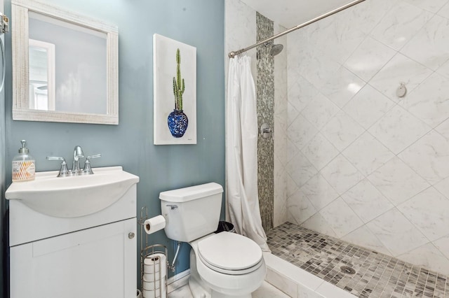 bathroom featuring toilet, vanity, and walk in shower