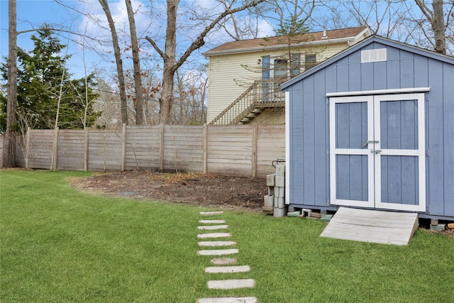 view of shed with a fenced backyard