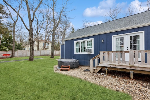 exterior space with french doors, a wooden deck, and fence