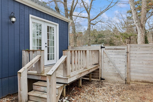 deck with french doors and fence