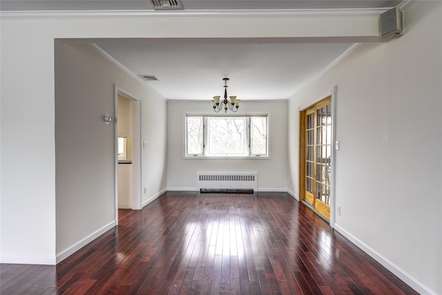 unfurnished room featuring ornamental molding, hardwood / wood-style floors, a notable chandelier, and radiator