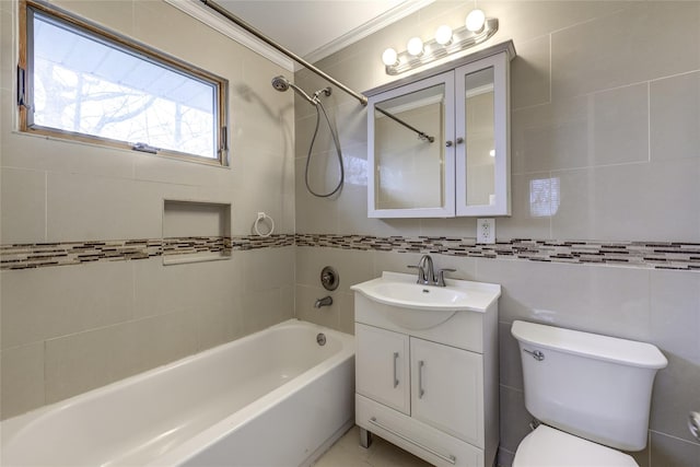 bathroom featuring toilet, vanity, tile walls, tub / shower combination, and tasteful backsplash