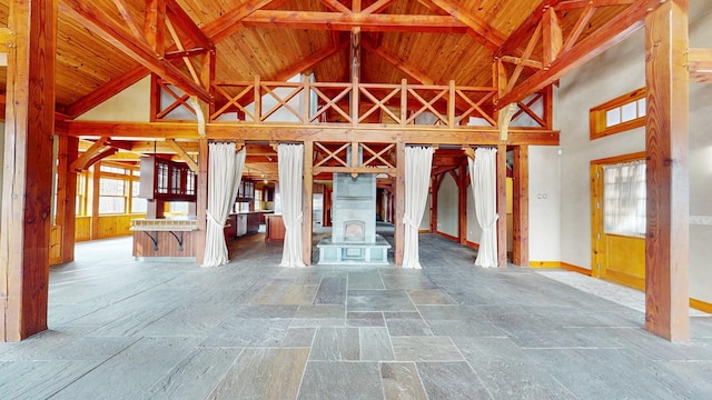 miscellaneous room featuring high vaulted ceiling, wooden ceiling, and beamed ceiling