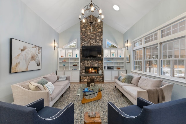 living room featuring an inviting chandelier, a stone fireplace, and high vaulted ceiling