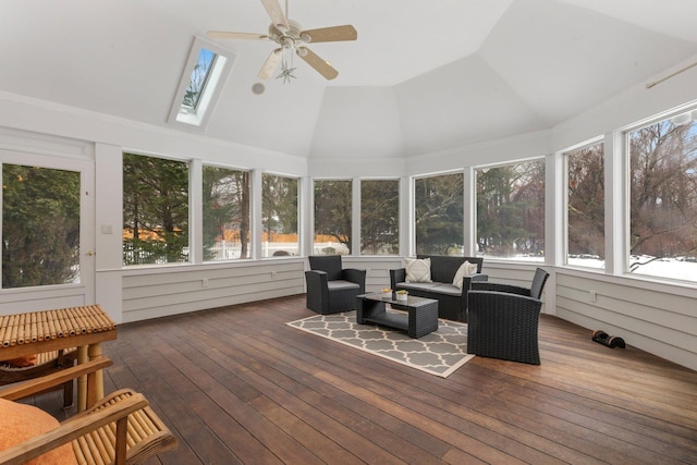 sunroom featuring ceiling fan, a healthy amount of sunlight, and lofted ceiling with skylight